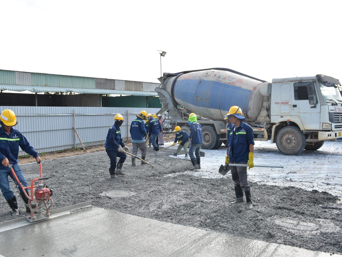Site crew working with a concrete mixer